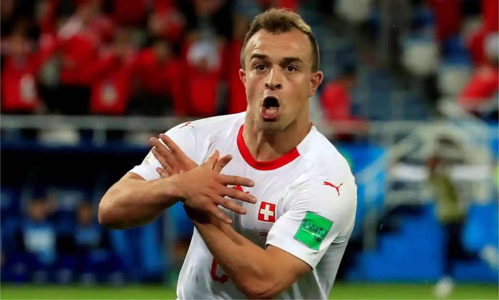 Xherdan Shaqiri celebrating with the double-headed eagle gesture in the World Cup game against Serbia on 22 June 2018.
© Fuentes/Reuters.
