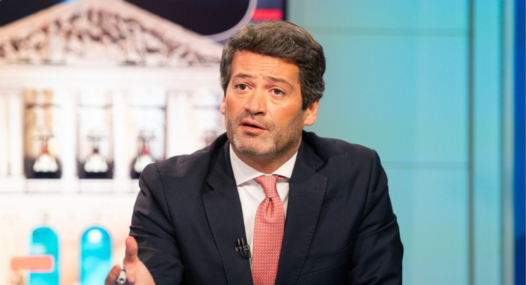 Andre Ventura is a man wearing a red tie and a dark suit.