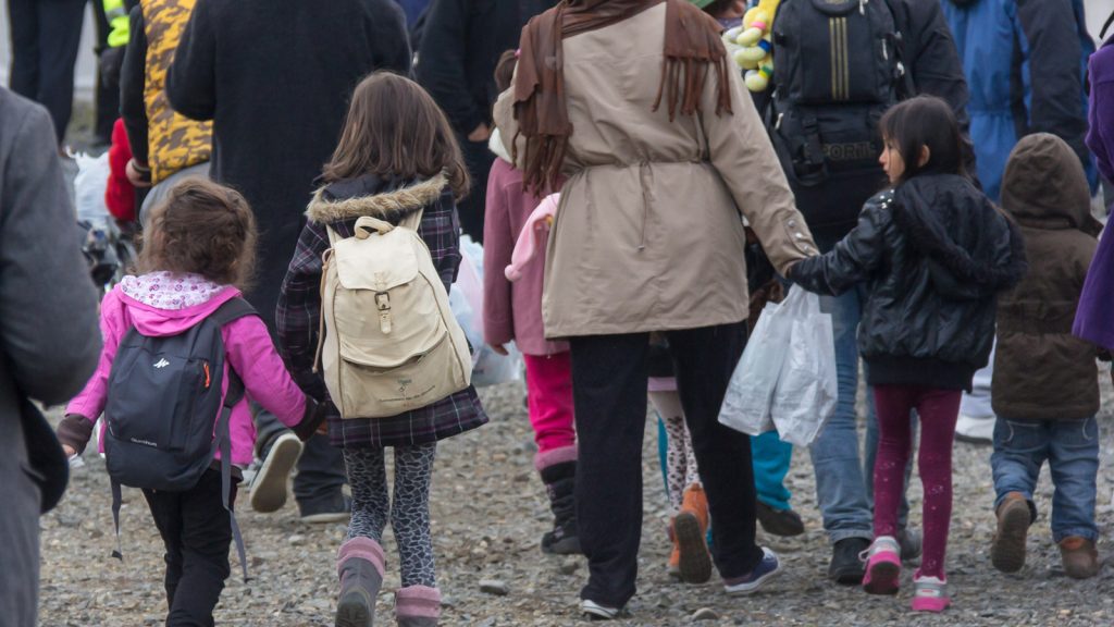 Syrian refugees arrive at the airport in Bonn, Germany